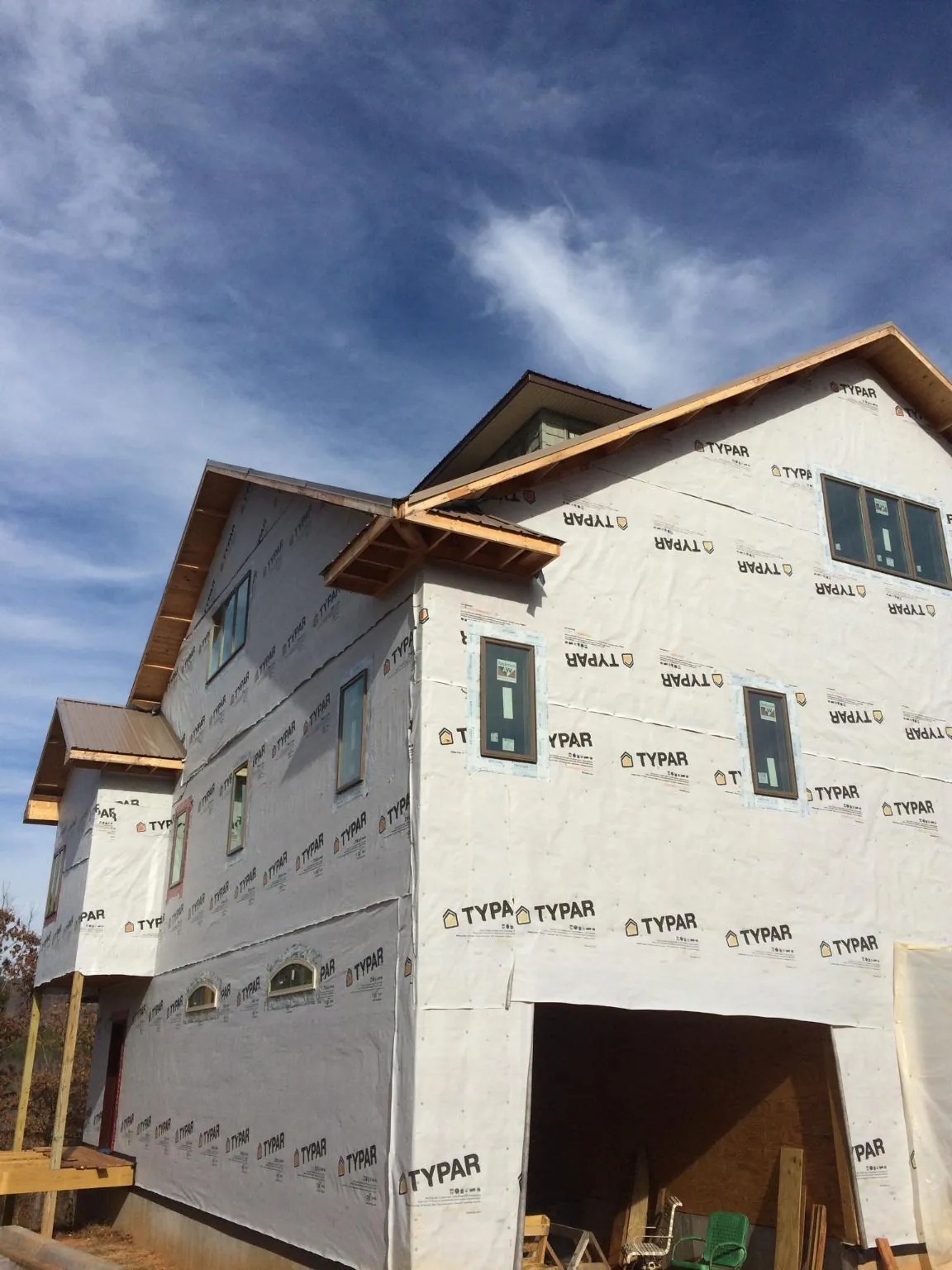 Stick built house wrapped in Typar with new roof framing and dormers in Walton